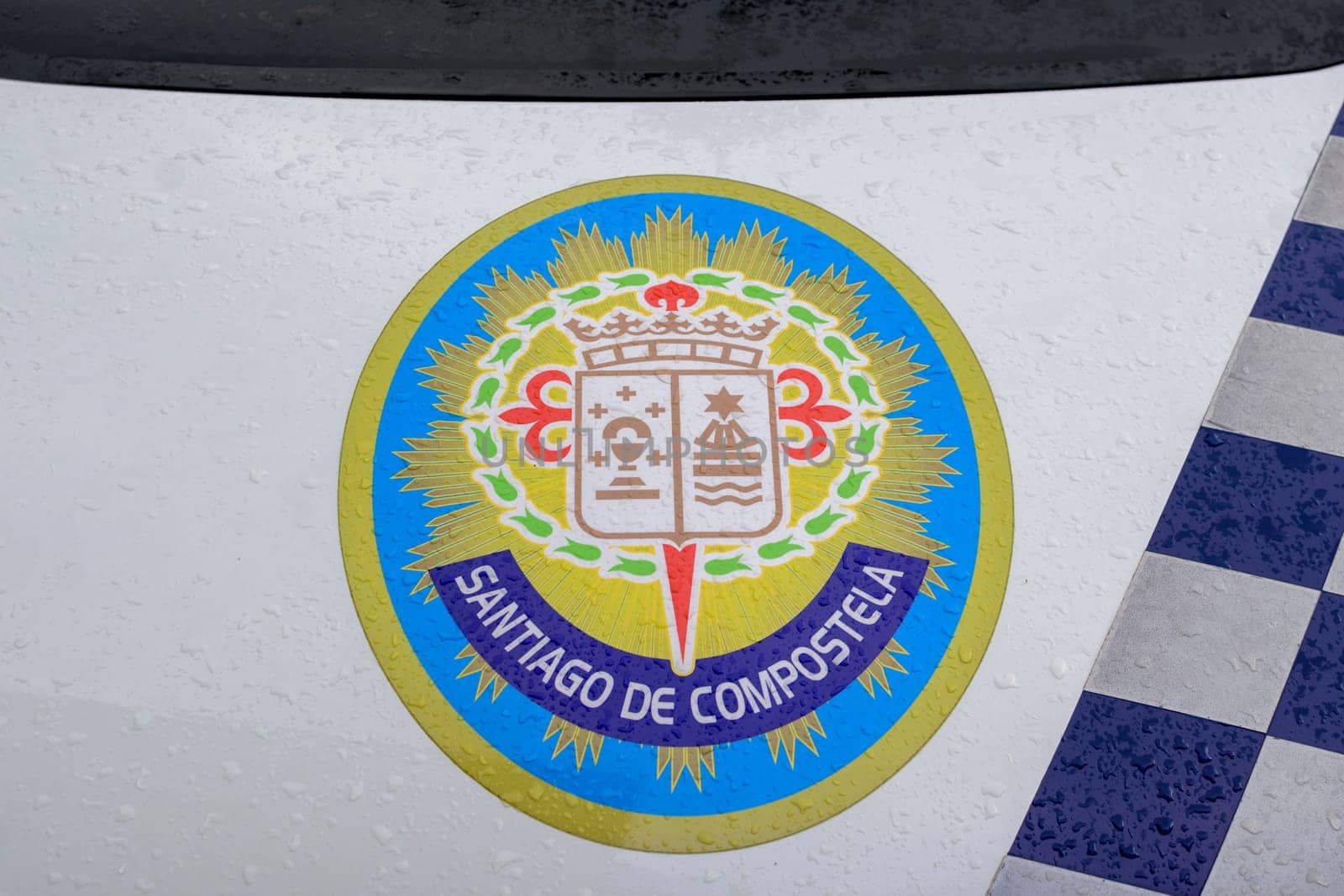 Santiago de Composteal, Spain, September 11th 2023: Santiago de Compostela logo on the hood of a police car.