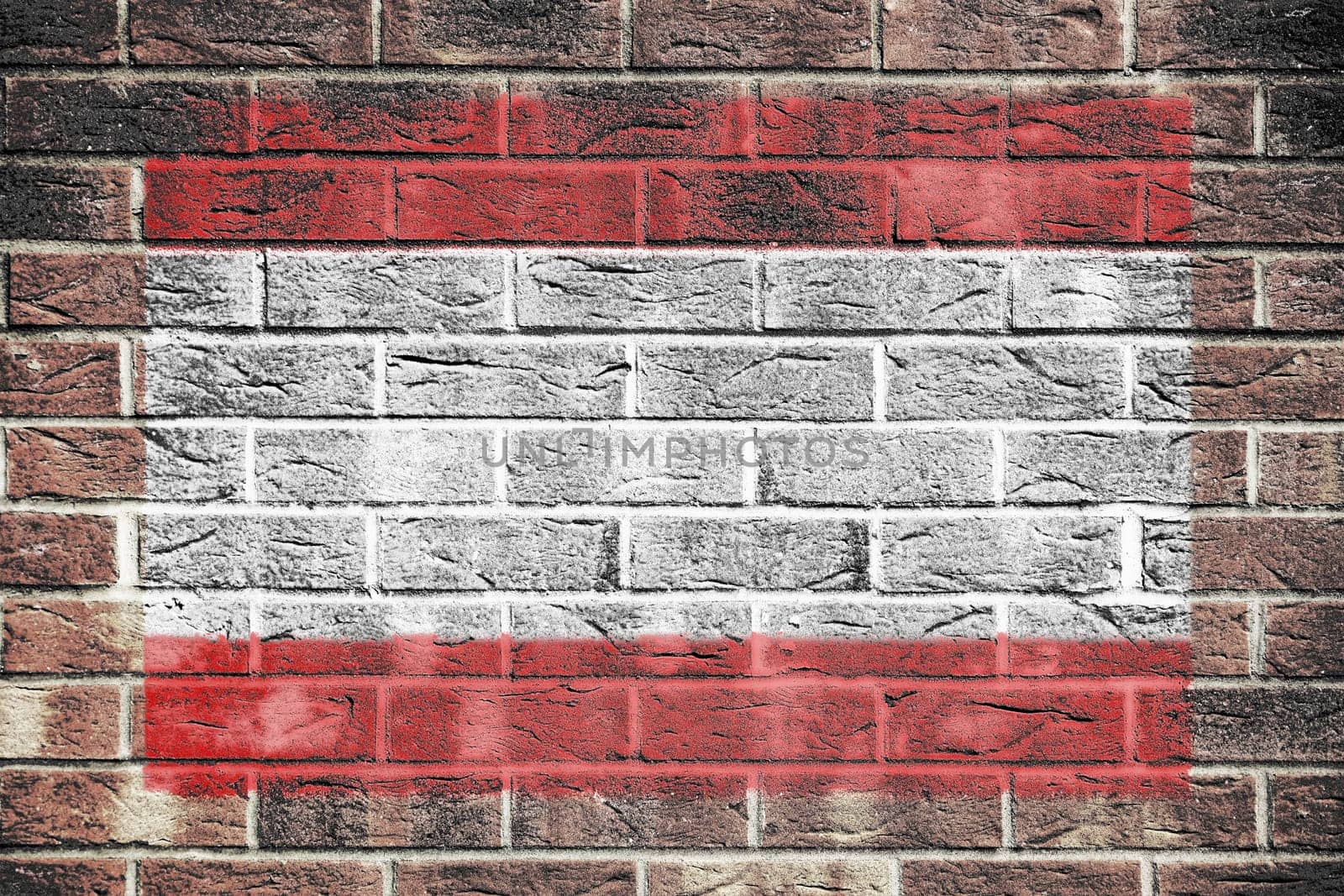 A Tahiti flag on a brick wall background