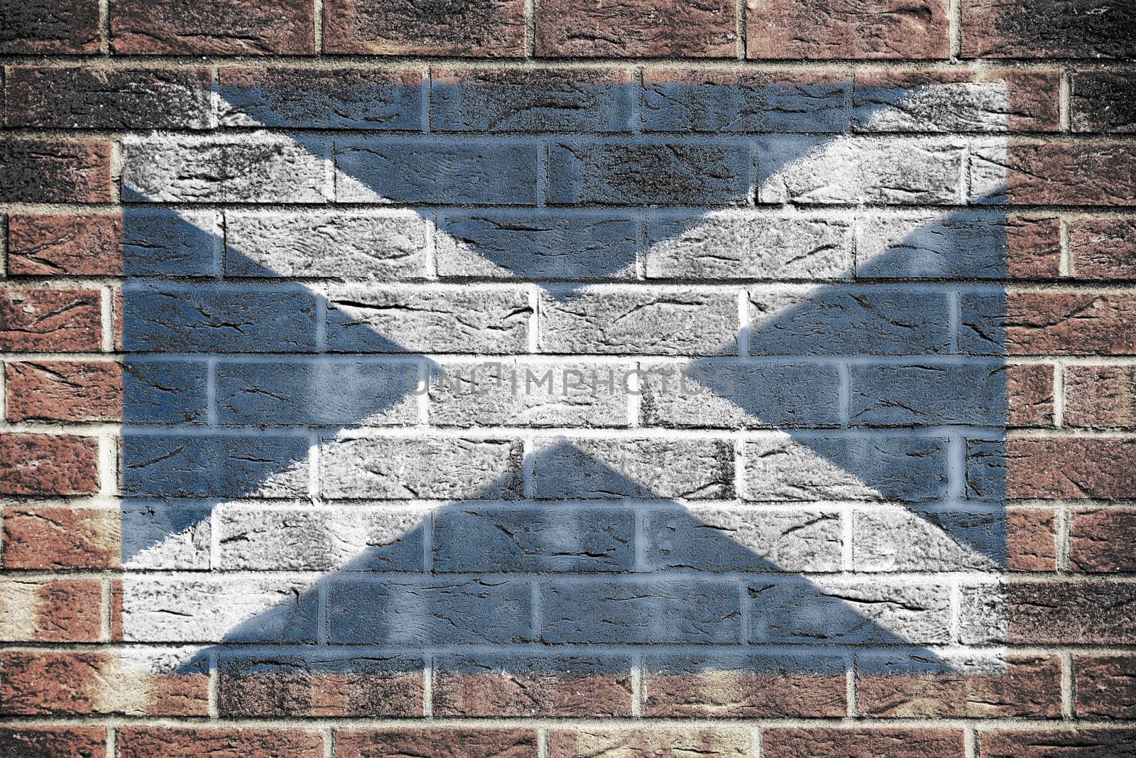 A Scotland flag on a brick wall background cross of Saint Andrew