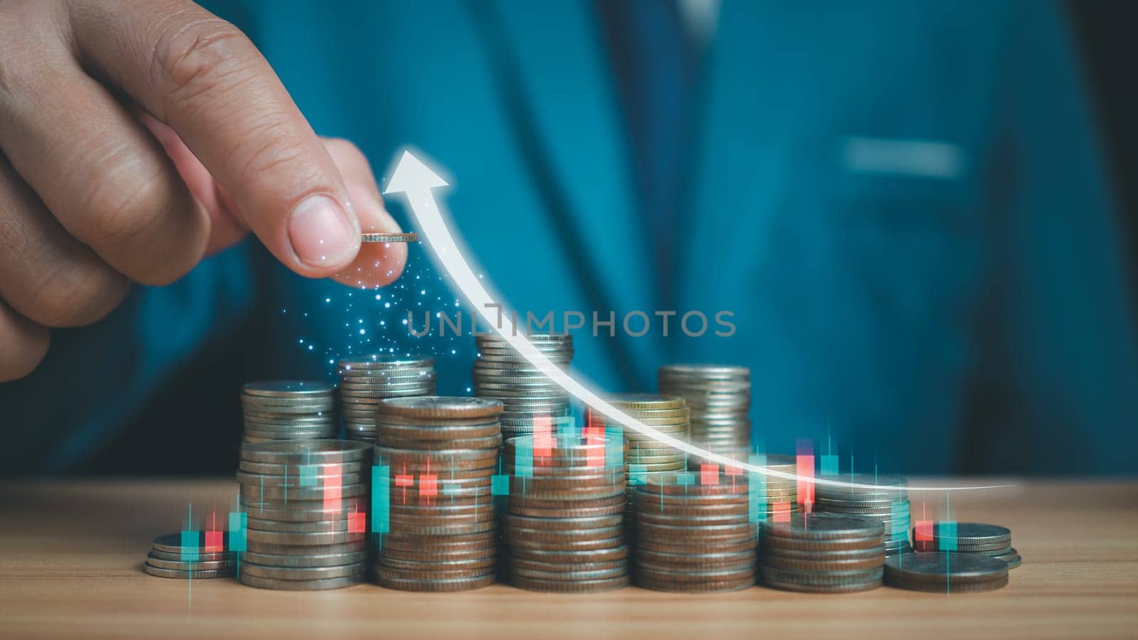 Businessman puts money on pile of coins. Ideas for investing and growing a business, maximizing profits from business, ideas for setting savings goals and setting goals for fixed deposits with banks.
