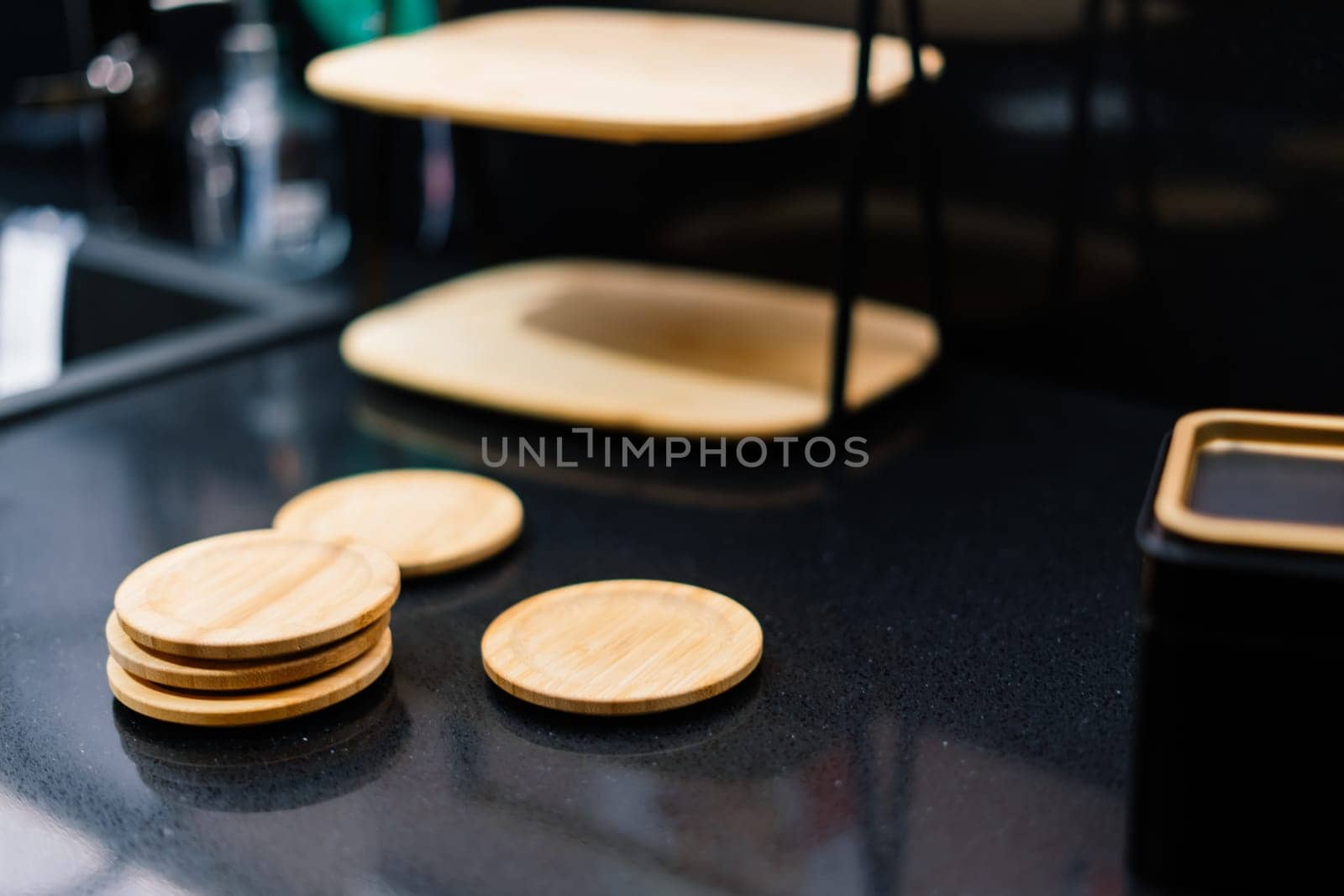 Wooden kitchen utensils stacked view, spoons, bowls plate