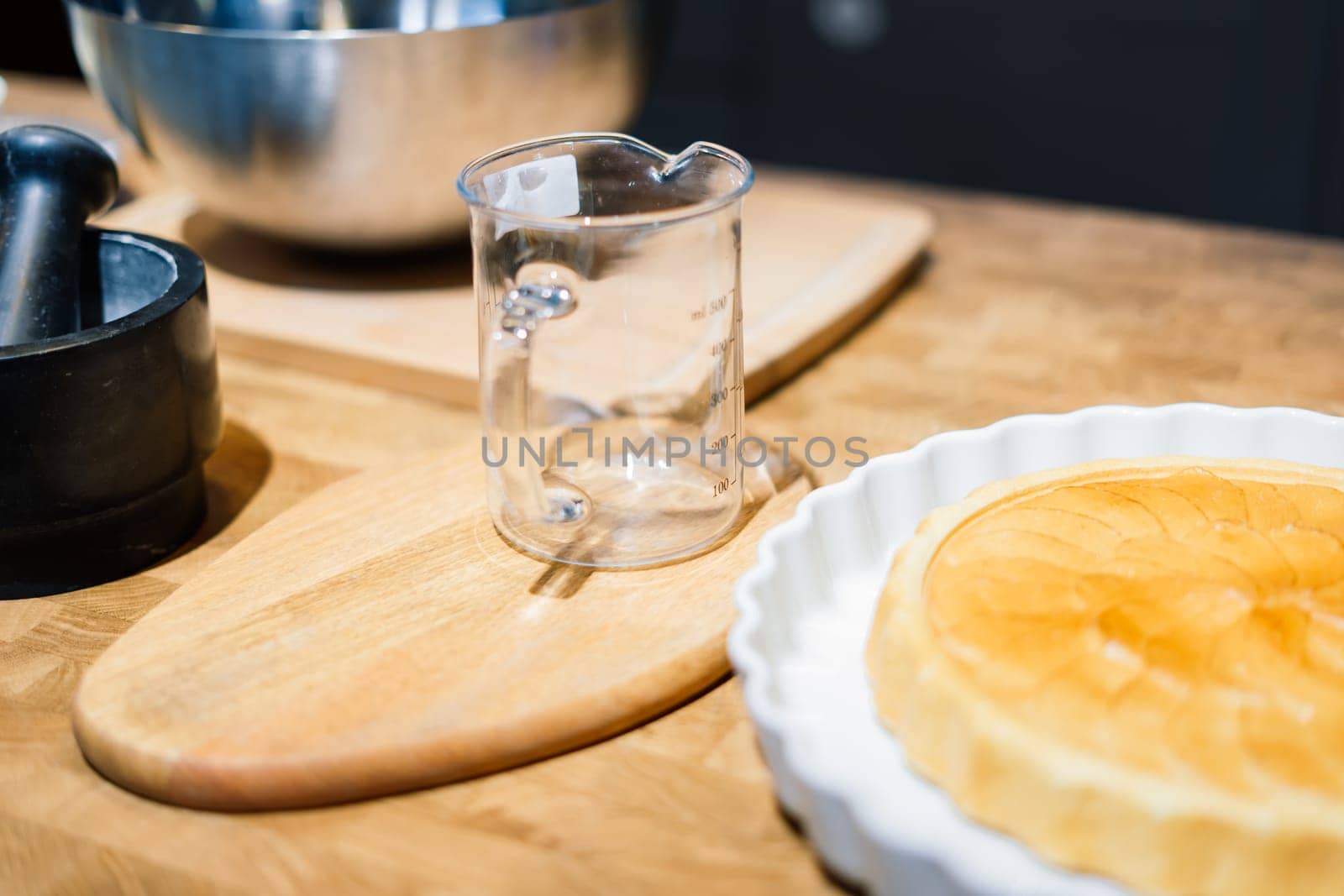Wooden kitchen utensils stacked view, spoons, bowls plate