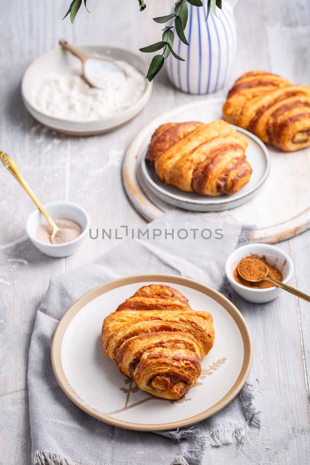 Cinnamon rolls or Franzbroetchen -  Germany sweet pastry sweet pastry baked with butter and cinnamon,  croissant