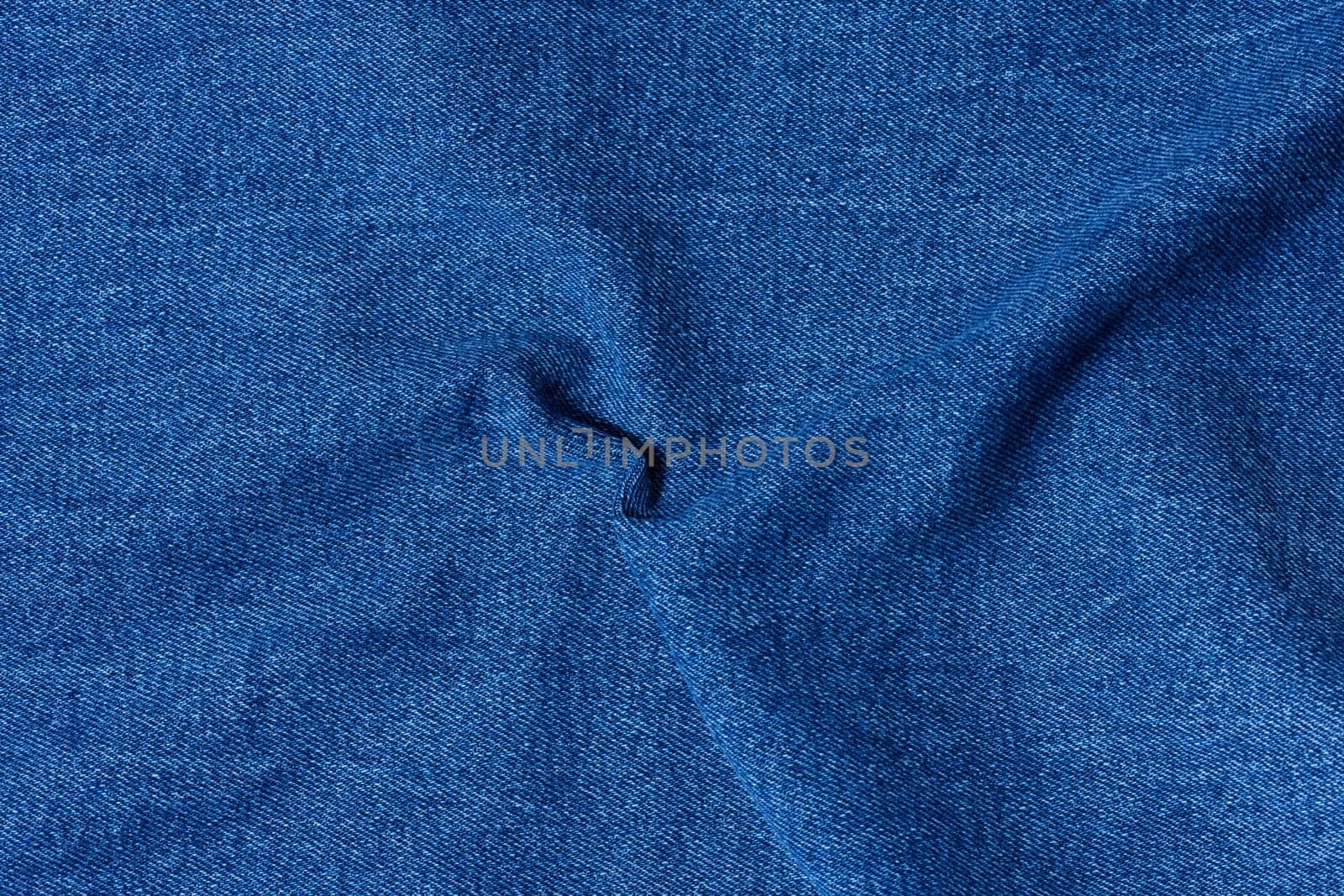 Blue denim, fabric twisted, close up