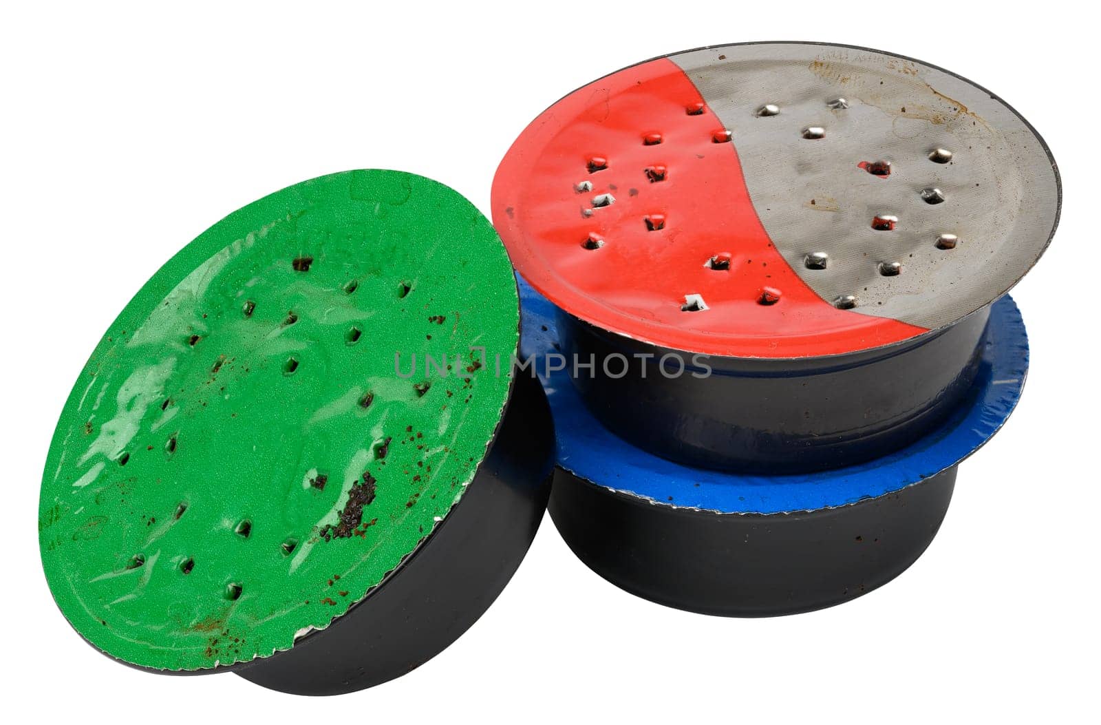 Used coffee capsule for coffee machine on a white background, plastic packaging
