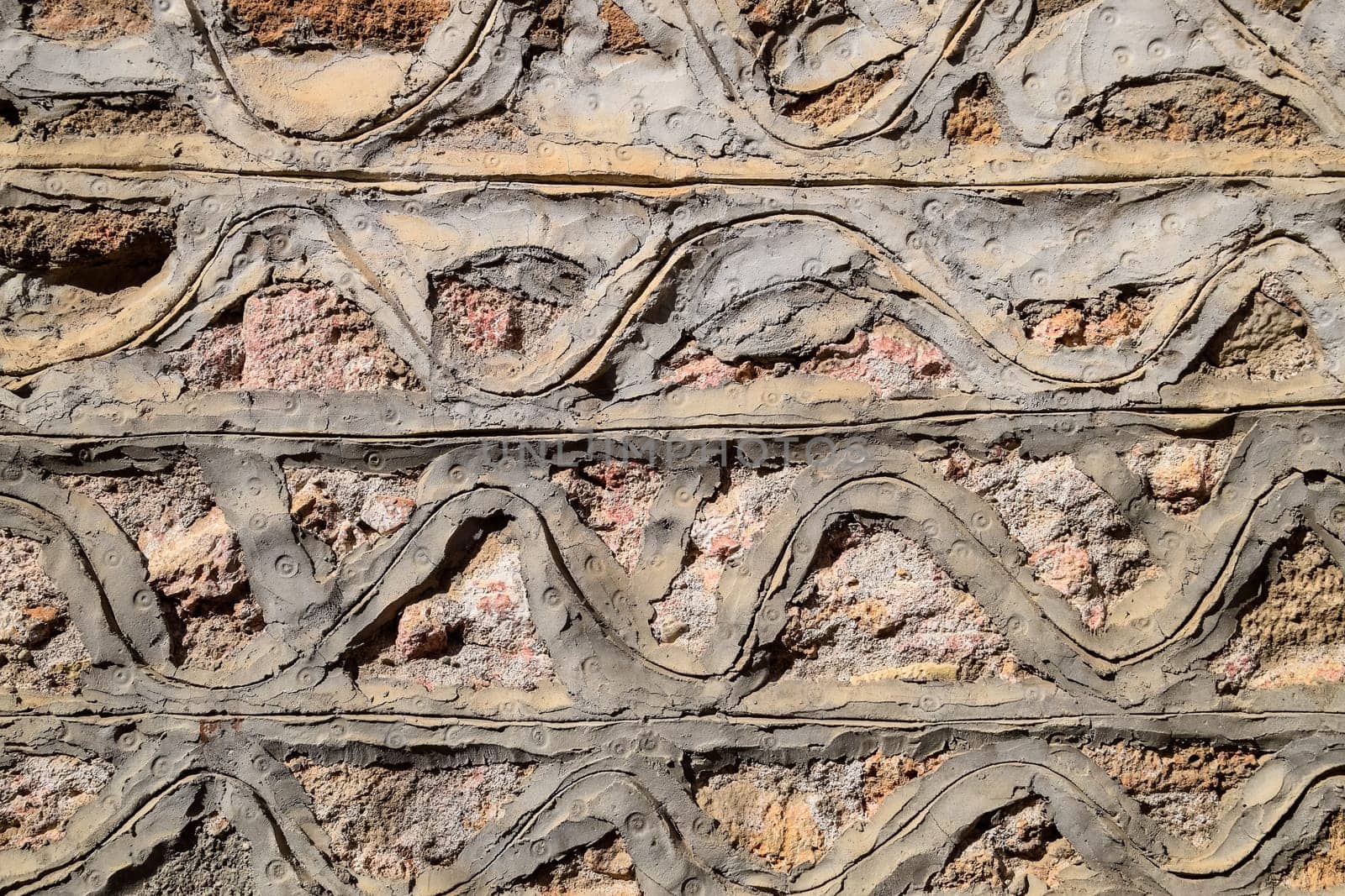 Background texture of cement and limestone walls with bricks.