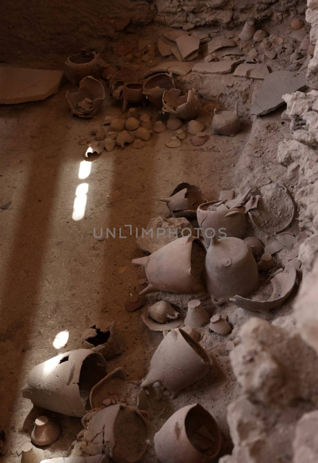 Santorini, Greece - July 01, 2021: Recovered ancient pottery in prehistoric town of Akrotiri, excavation site of a Minoan Bronze Age settlement on the Greek island of Santorini
