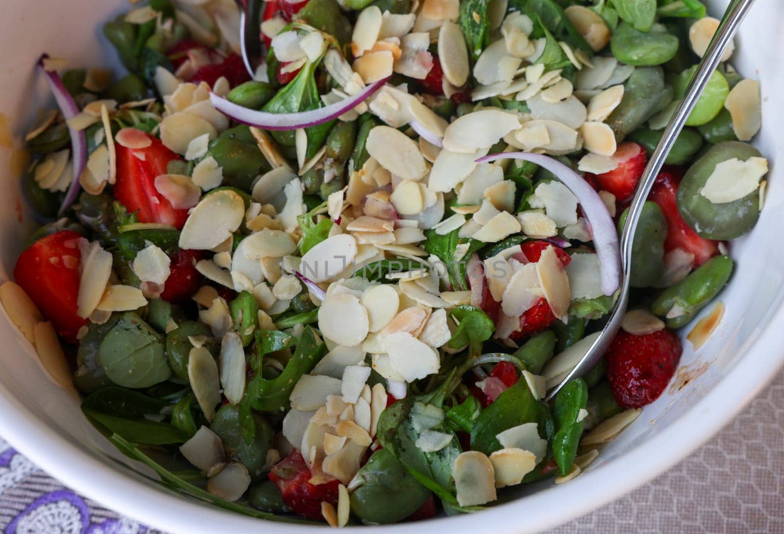 salad with strawberries and broad beans. Delicious dish in a healthy style