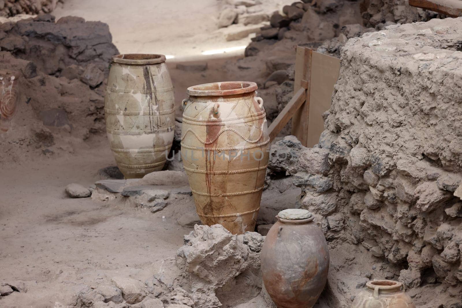Santorini, Greece - July 01, 2021: Recovered ancient pottery in prehistoric town of Akrotiri, excavation site of a Minoan Bronze Age settlement on the Greek island of Santorini