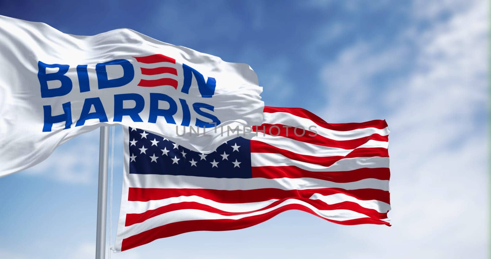 Washington D.C., US, June 20 2023: Biden Harris 2024 presidential campaign flag waving with the american flag. Illustrative editorial 3d illustration render. 2024 US presidential election