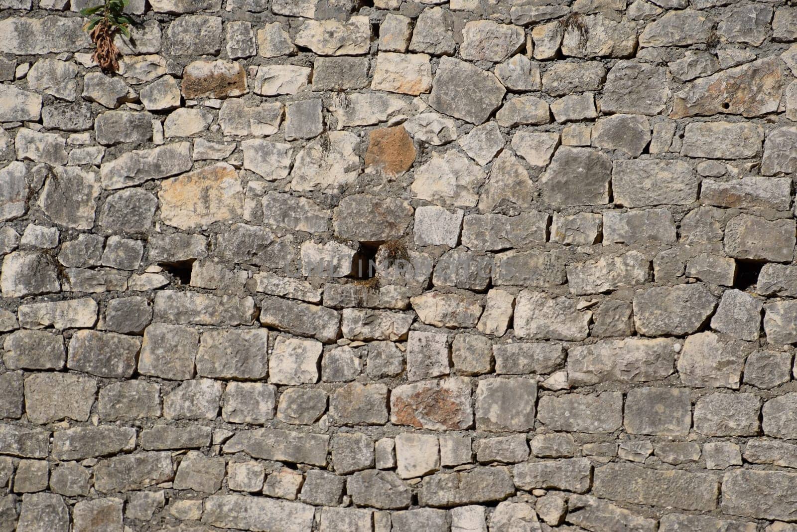 Background texture of cement and limestone walls with bricks. Stones and cement masonry walls.