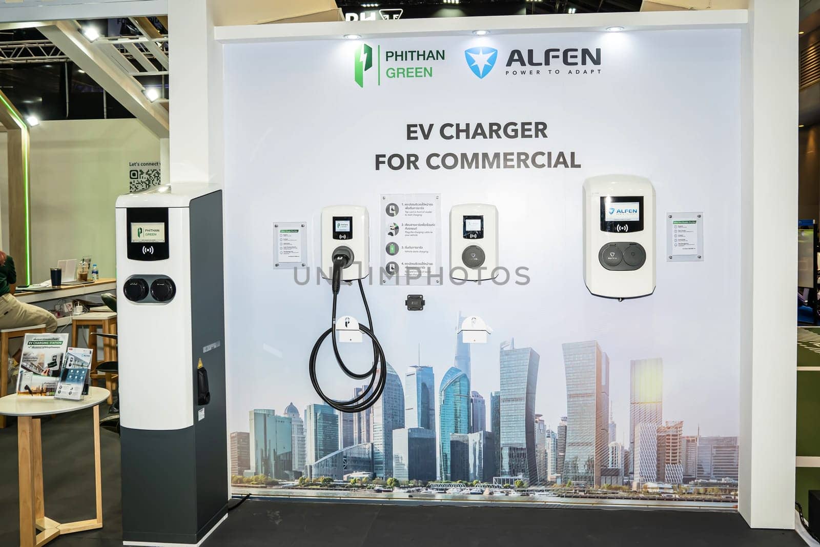 Nonthaburi, Thailand - APR 2, 2023 Electric car and chargers at The 44th Bangkok international motor show 2023 at IMPACT Arena, Muang Thong Thani, Nonthaburi, Thailand.