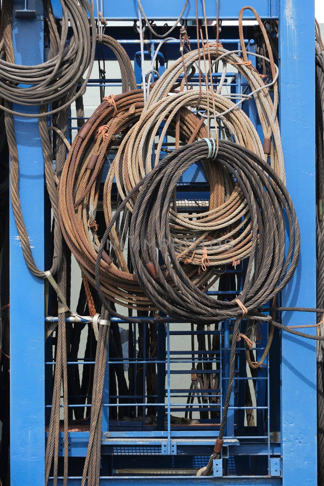 Old sling rope steel on a vessel in a harbour. texture style