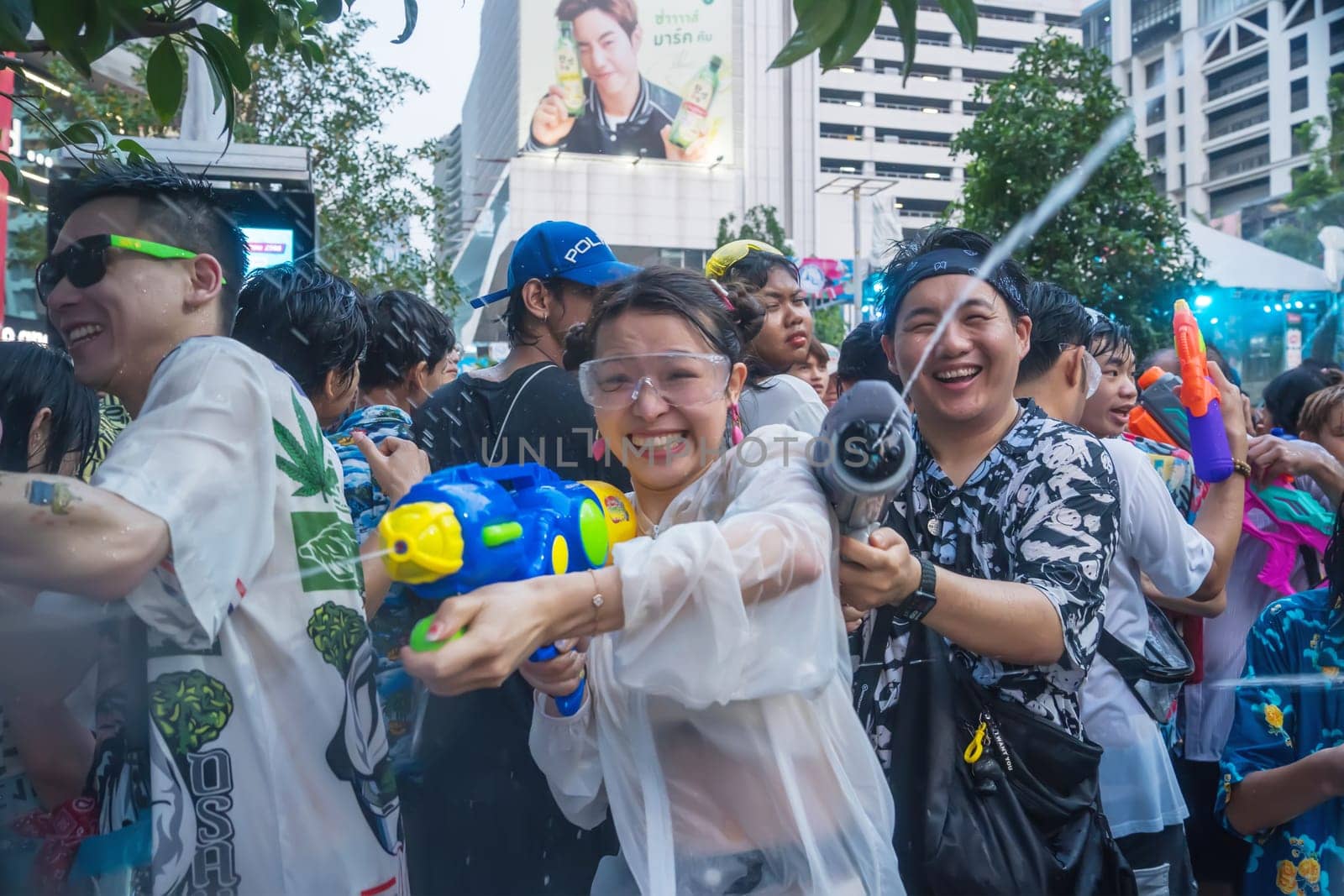 Siam Square, Bangkok, Thailand - APR 14, 2023 Songkran Festival, The short action of people joins celebrations of the Thai New Year or Songkran in Siam Square Bangkok, Thailand.