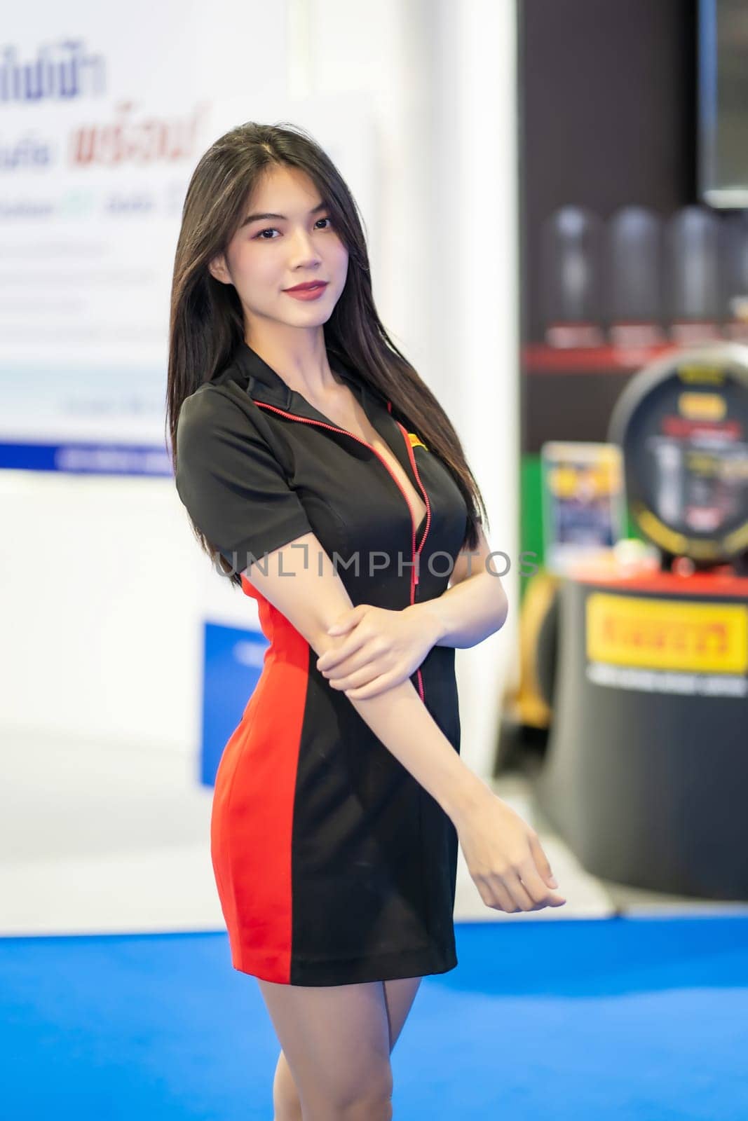 Nonthaburi, Thailand - MAR 26, 2023 Unidentified model poses with a car at The 44th Bangkok international motor show 2023 at IMPACT Arena, Muang Thong Thani, Nonthaburi, Thailand.