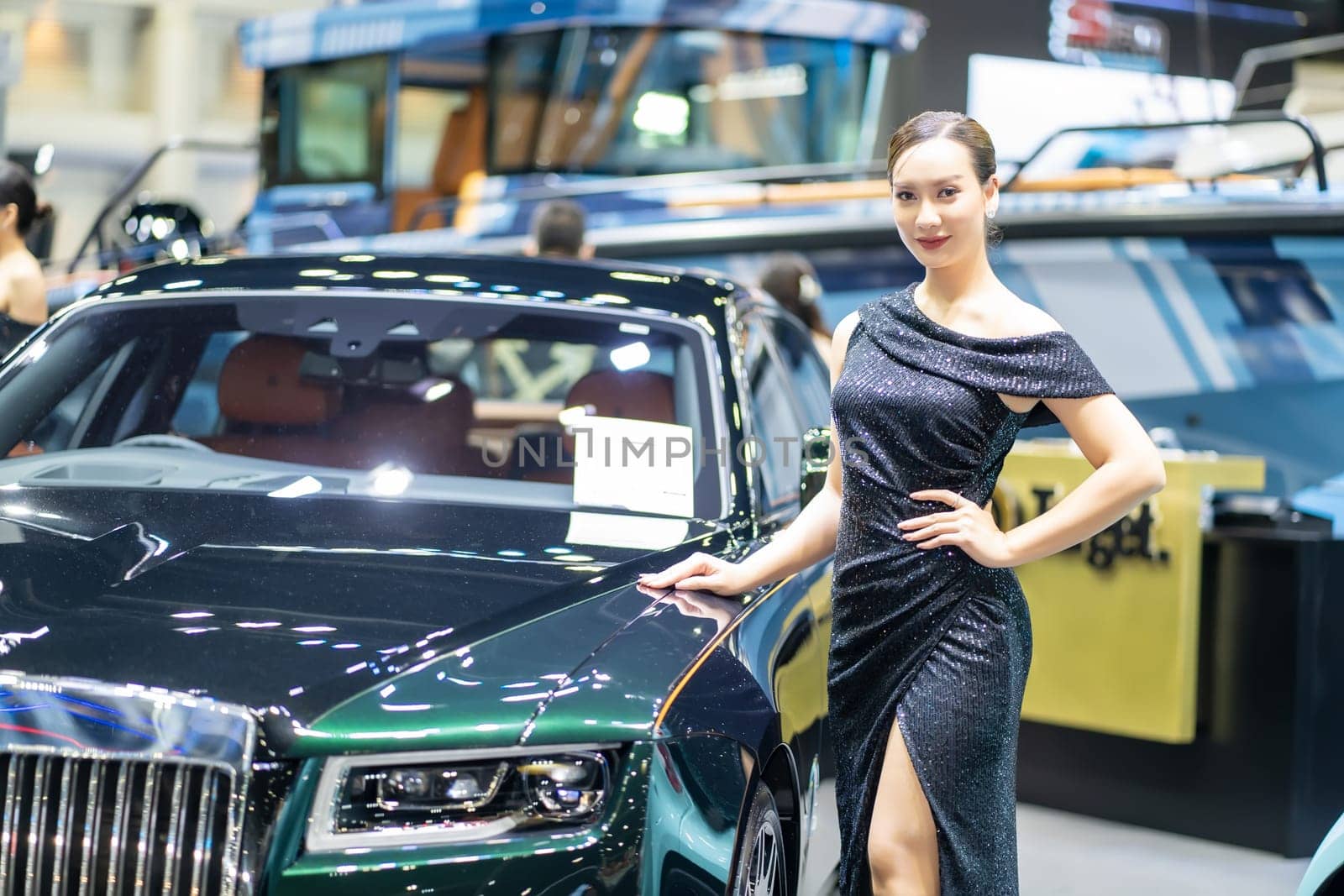 Nonthaburi, Thailand - MAR 26, 2023 Unidentified model poses with a car at The 44th Bangkok international motor show 2023 at IMPACT Arena, Muang Thong Thani, Nonthaburi, Thailand.