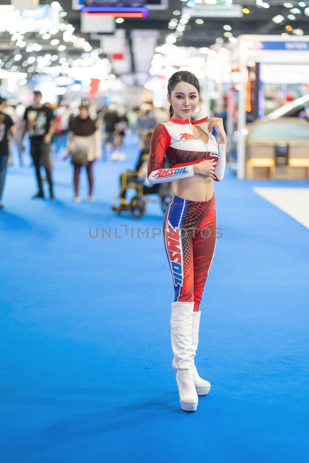 Nonthaburi, Thailand - MAR 26, 2023 Unidentified model poses with a car at The 44th Bangkok international motor show 2023 at IMPACT Arena, Muang Thong Thani, Nonthaburi, Thailand.