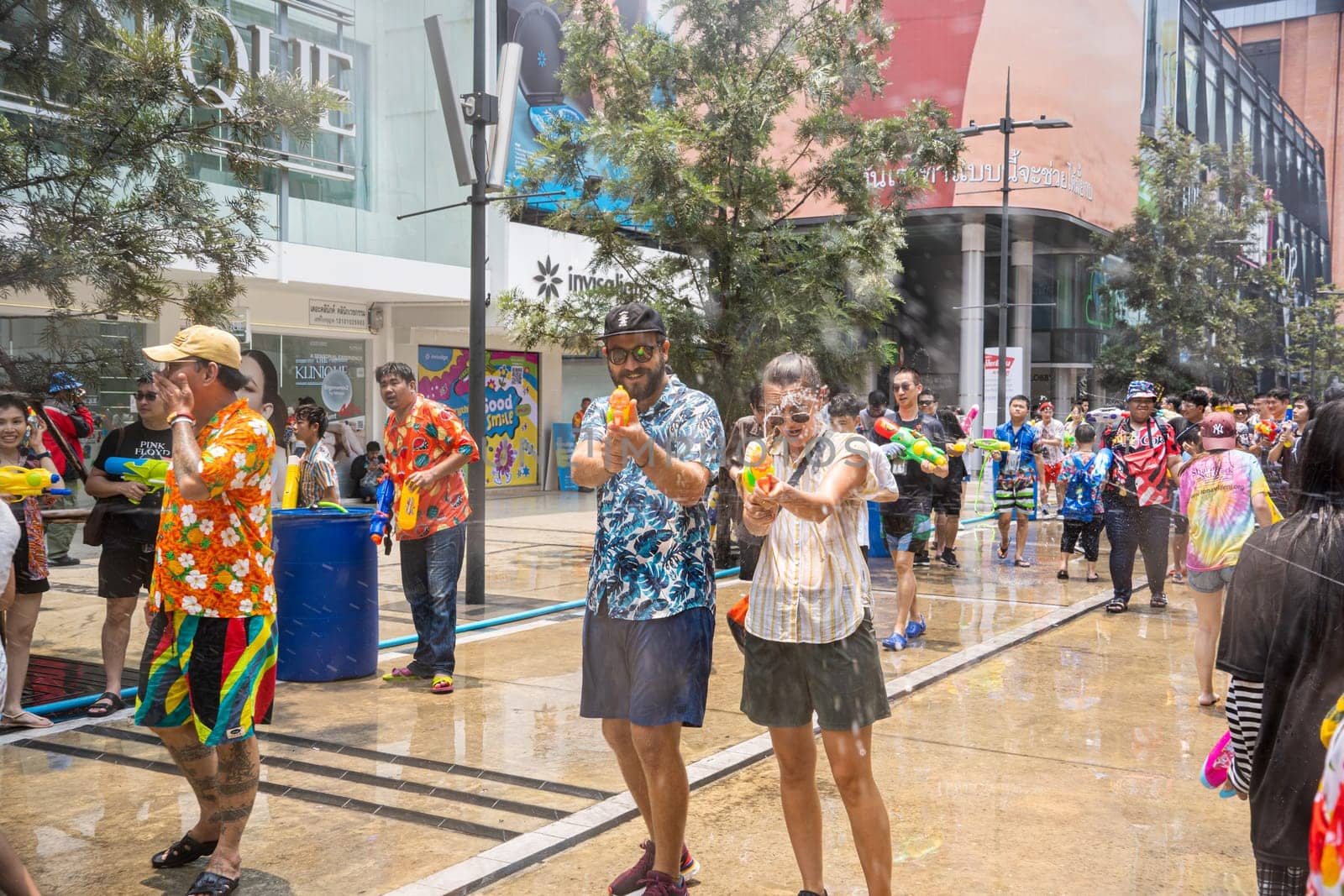 Siam Square, Bangkok, Thailand - APR 13, 2023 Songkran Festival, The short action of people joins celebrations of the Thai New Year or Songkran in Siam Square Bangkok, Thailand.