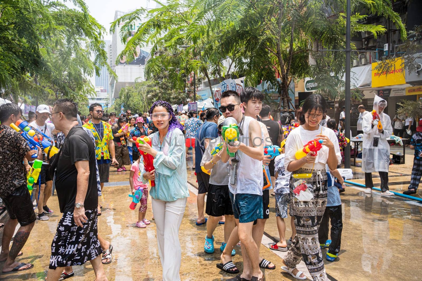 Siam Square, Bangkok, Thailand - APR 13, 2023 Songkran Festival, The short action of people joins celebrations of the Thai New Year or Songkran in Siam Square Bangkok, Thailand.