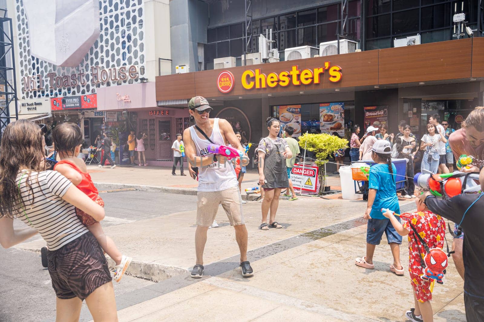 Siam Square, Bangkok, Thailand - APR 13, 2023 Songkran Festival, The short action of people joins celebrations of the Thai New Year or Songkran in Siam Square Bangkok, Thailand.