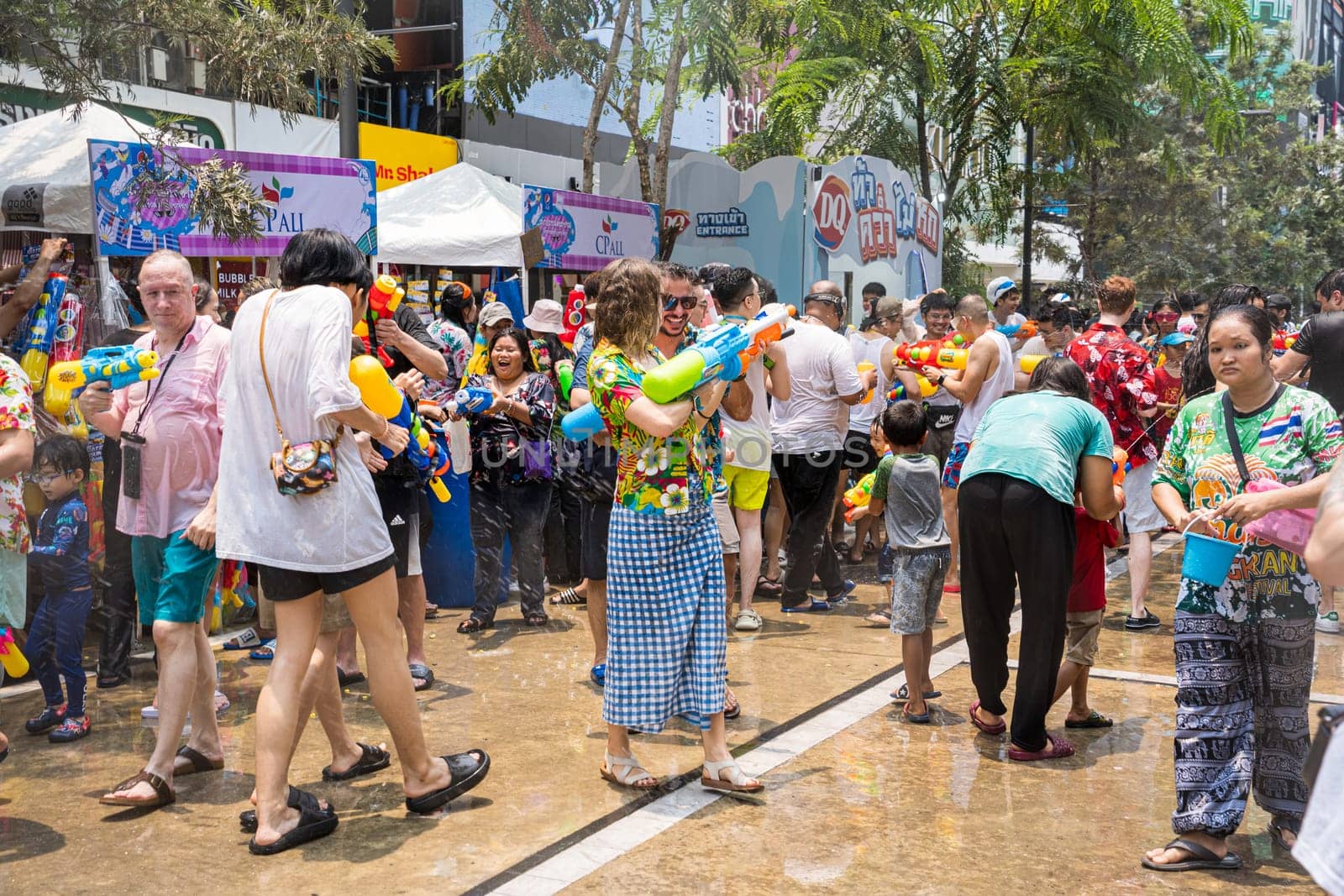 Siam Square, Bangkok, Thailand - APR 13, 2023 Songkran Festival, The short action of people joins celebrations of the Thai New Year or Songkran in Siam Square Bangkok, Thailand.