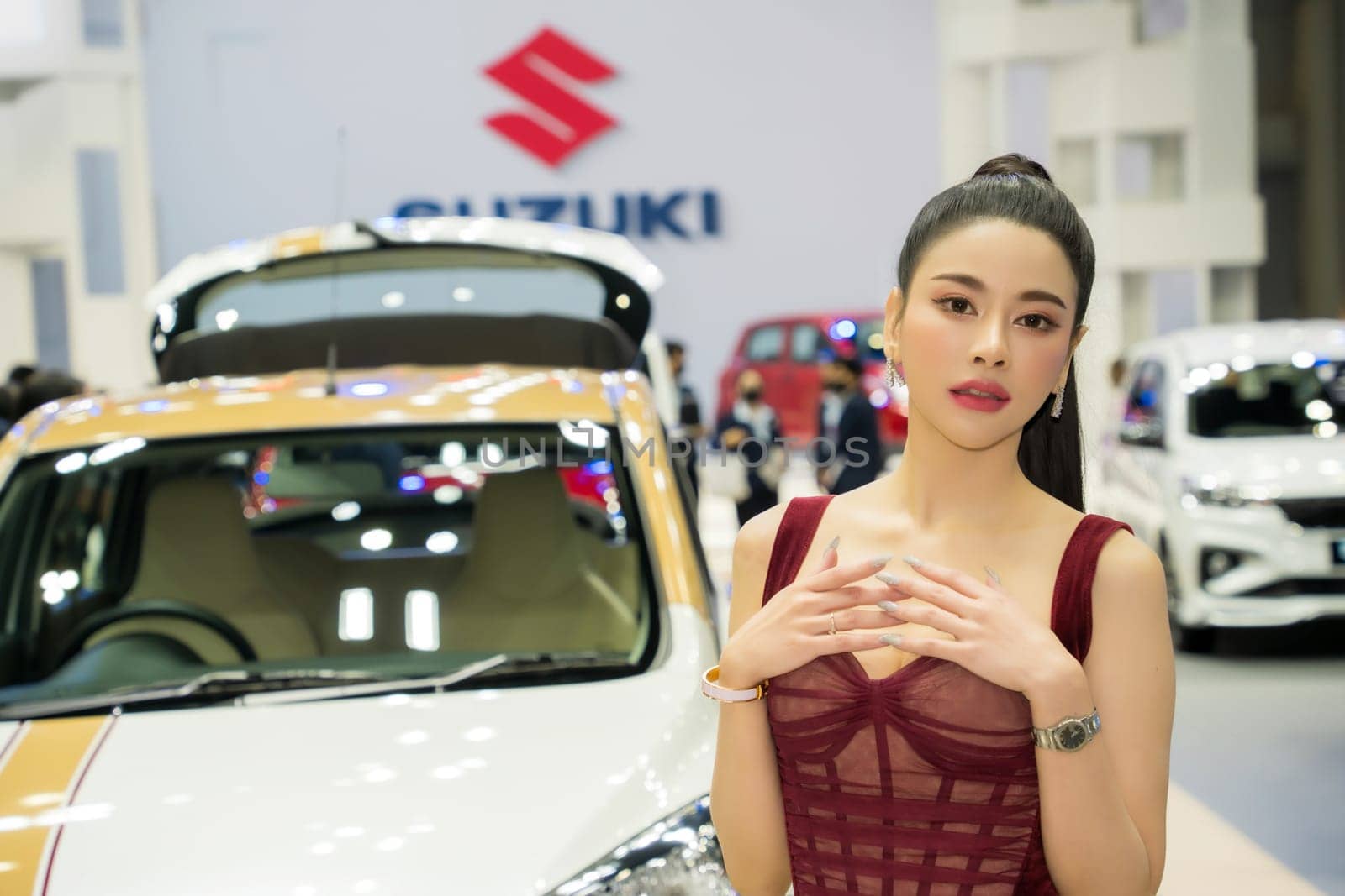 Nonthaburi, Thailand - APR 2, 2023 Unidentified model poses with a car at The 44th Bangkok international motor show 2023 at IMPACT Arena, Muang Thong Thani, Nonthaburi, Thailand.