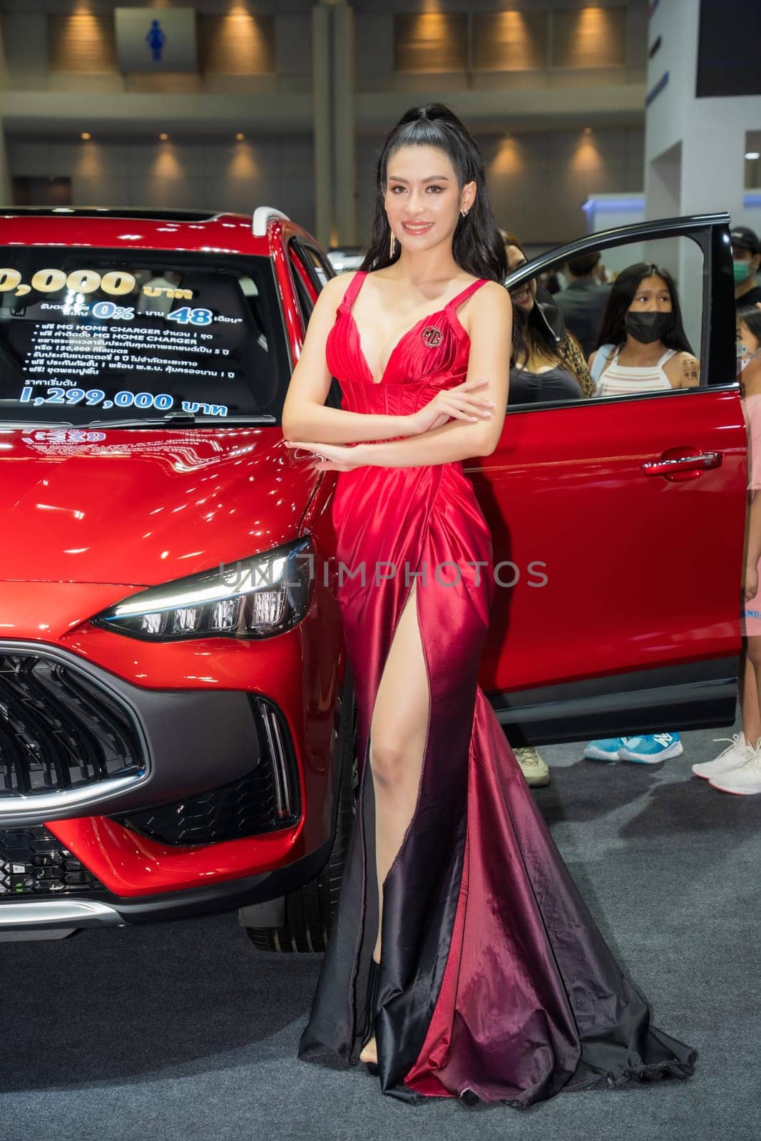 Nonthaburi, Thailand - APR 2, 2023 Unidentified model poses with a car at The 44th Bangkok international motor show 2023 at IMPACT Arena, Muang Thong Thani, Nonthaburi, Thailand.
