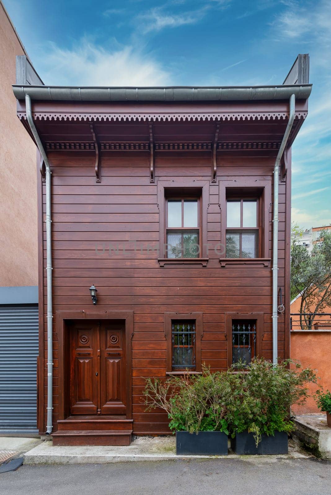 Facade of traditional wooden residential building, at an alley in Kuzguncuk neighborhood, Uskudar district, Istanbul, Turkey