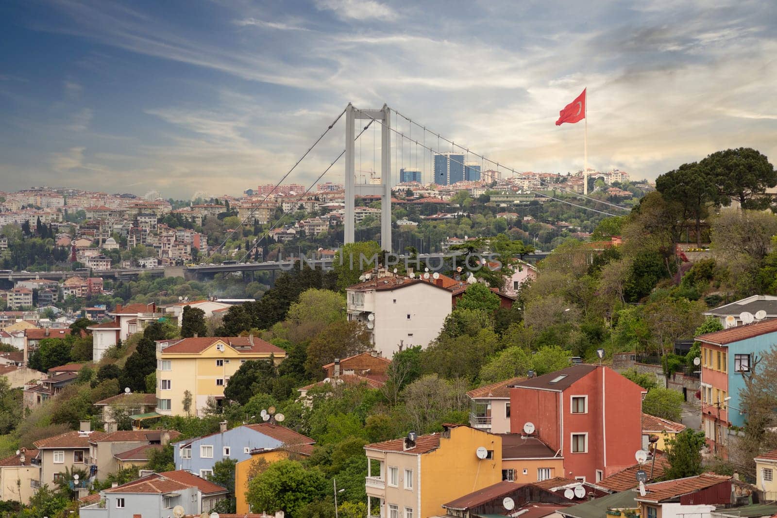 Cityscape of Istanbul, Turkey from Pervititch Seyir Park before sunset, with a skyline including traditional residential buildings on the European side, and Bosphorus Bridge