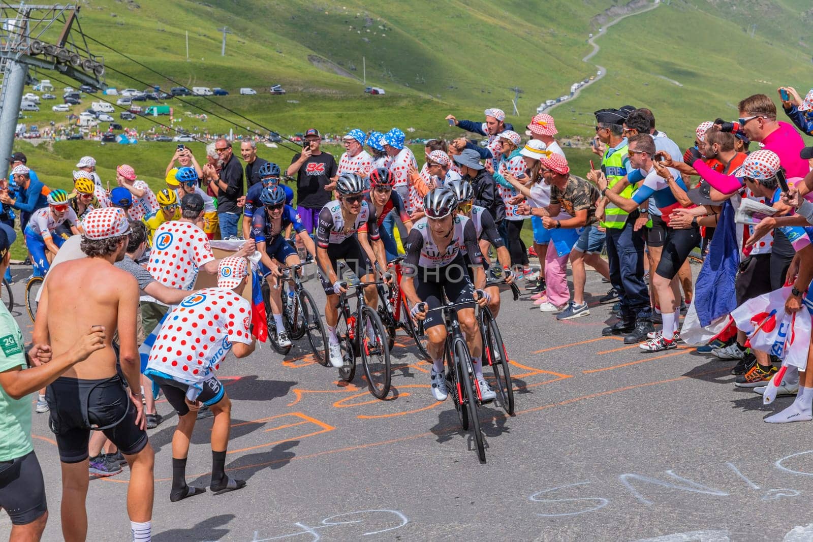 Col du Tourmalet, France - July 06 2023: Emirates team climbig the road to Col du Tourmalet in Pyerenees mountains during the stage 6 of Le Tour de France 2023.