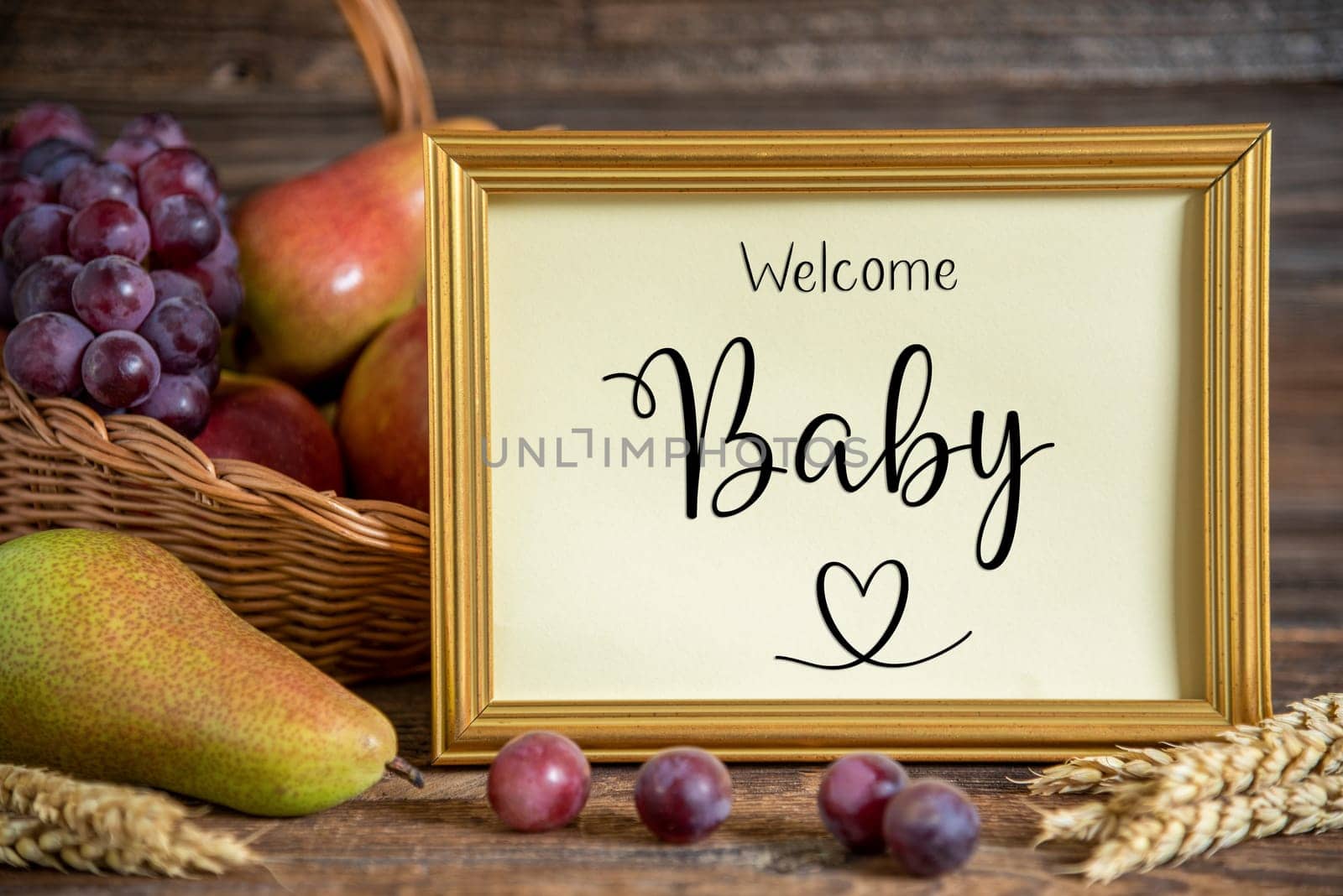 Fall Decoration with Pears, Apples and Grapes, Thanksgiving Background, Autumn Season and Text Welcome Baby