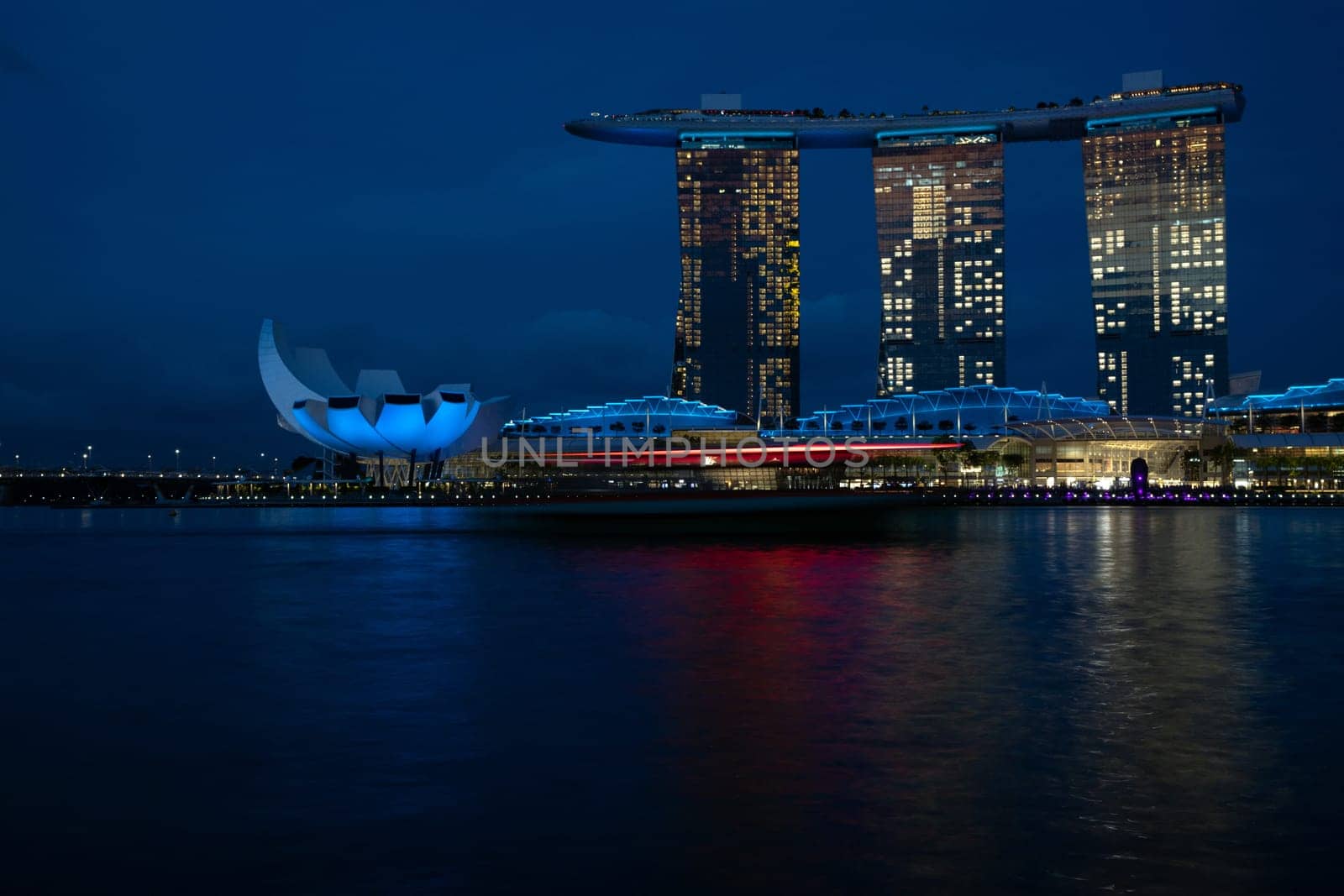Marina Bay, Singapore - 4, June, 2023 - The view of Art Science Museum and Sands Hotel illuminated at night