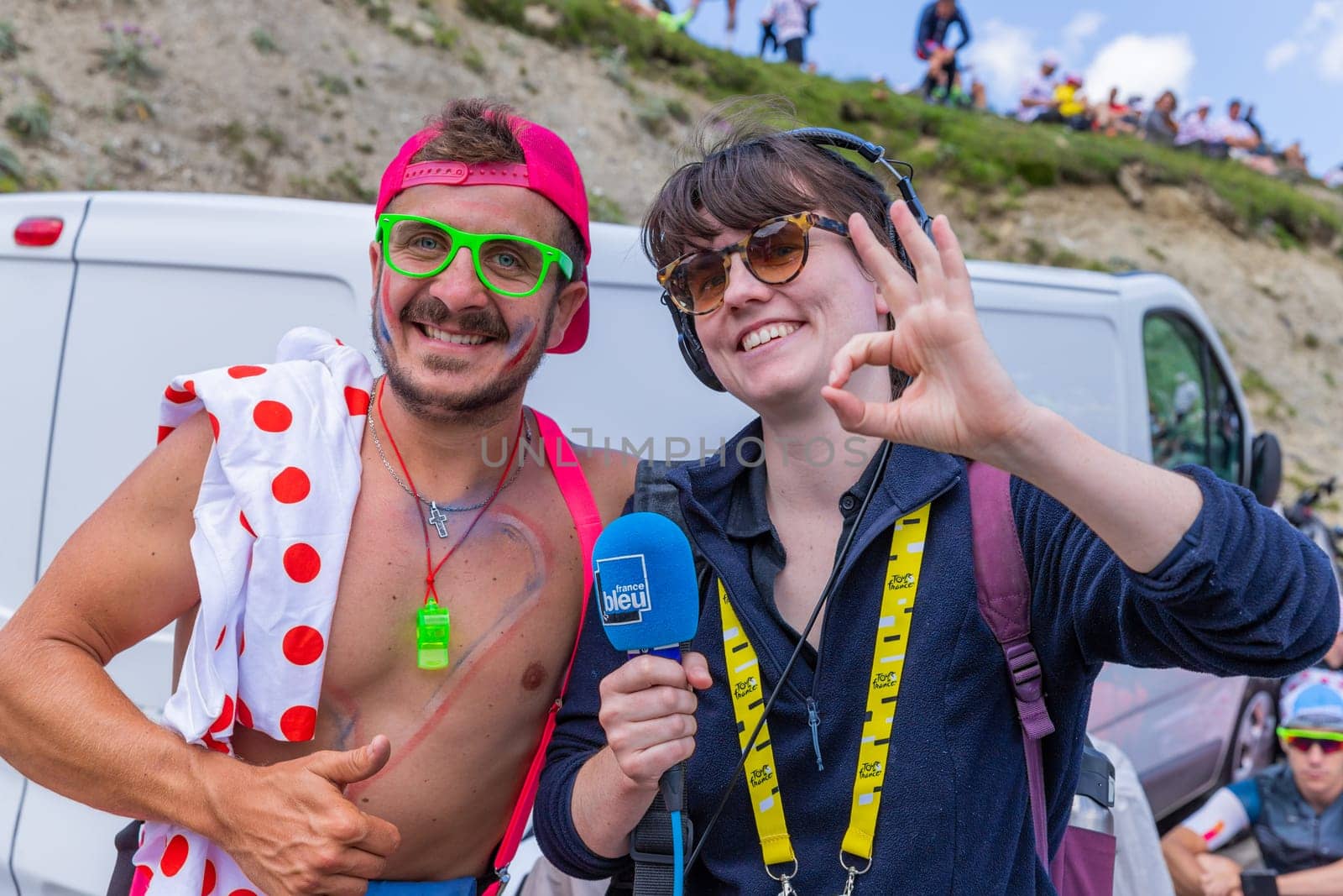 Col du Tourmalet, France - July 06 2023: Cycling fans waiting for the buch at the top of the Col du Tourmalet in Pyerenees mountains during the stage 6 of Le Tour de France 2023