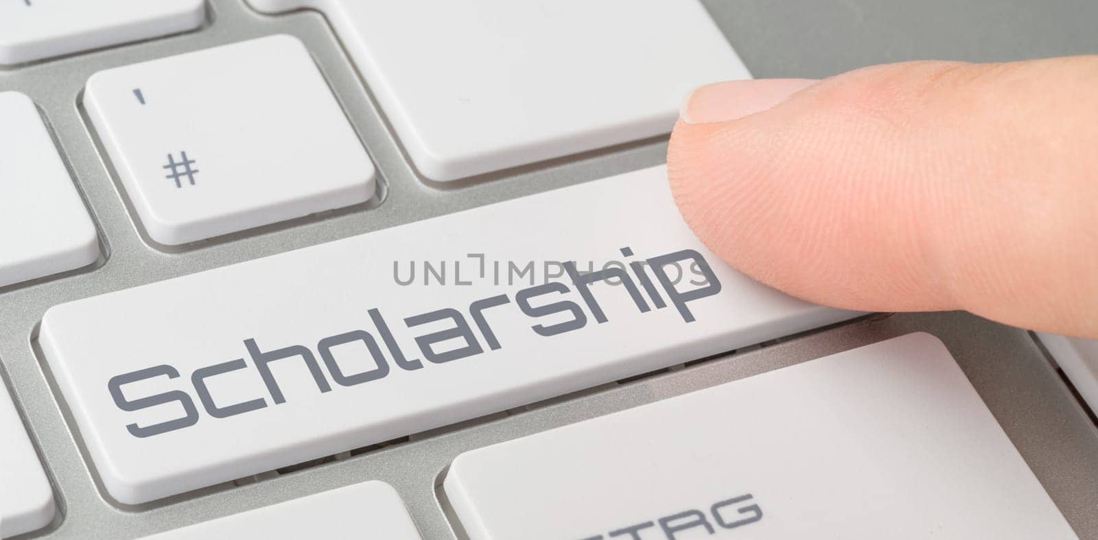 A keyboard with a labeled button - Scholarship