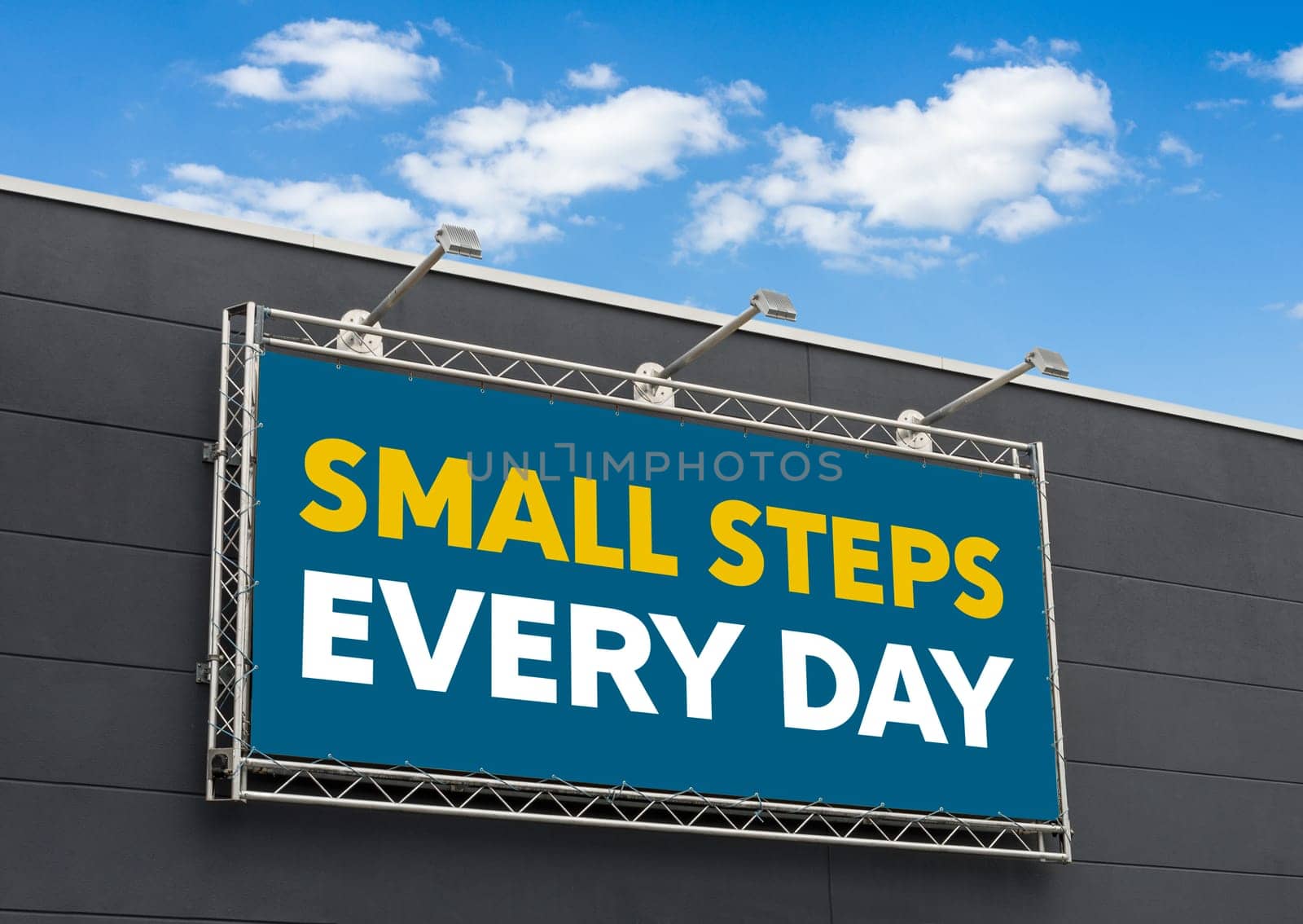 Small steps every day written on a billboard