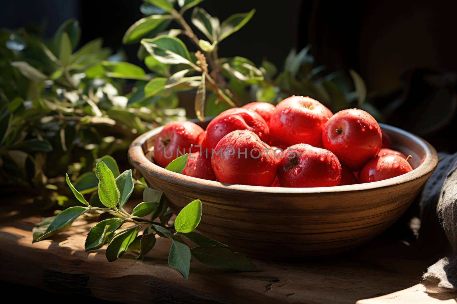 fresh red apples with leaves in a wooden box.