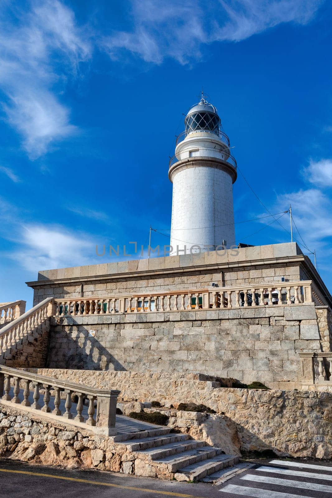 The beautiful lighthouse on the cliff of Cap Formentor. Balearic Islands Mallorca Spain. Vacation concept. One of the most visited landmark in Mallorca
