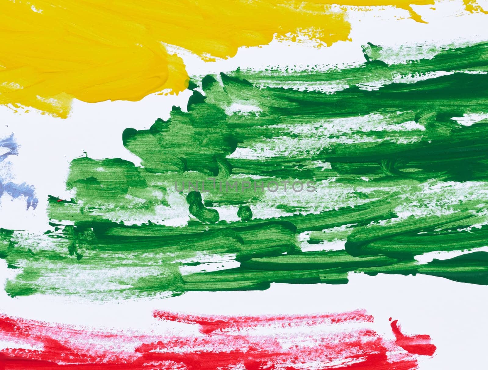 Strokes of green, yellow and red acrylic paint