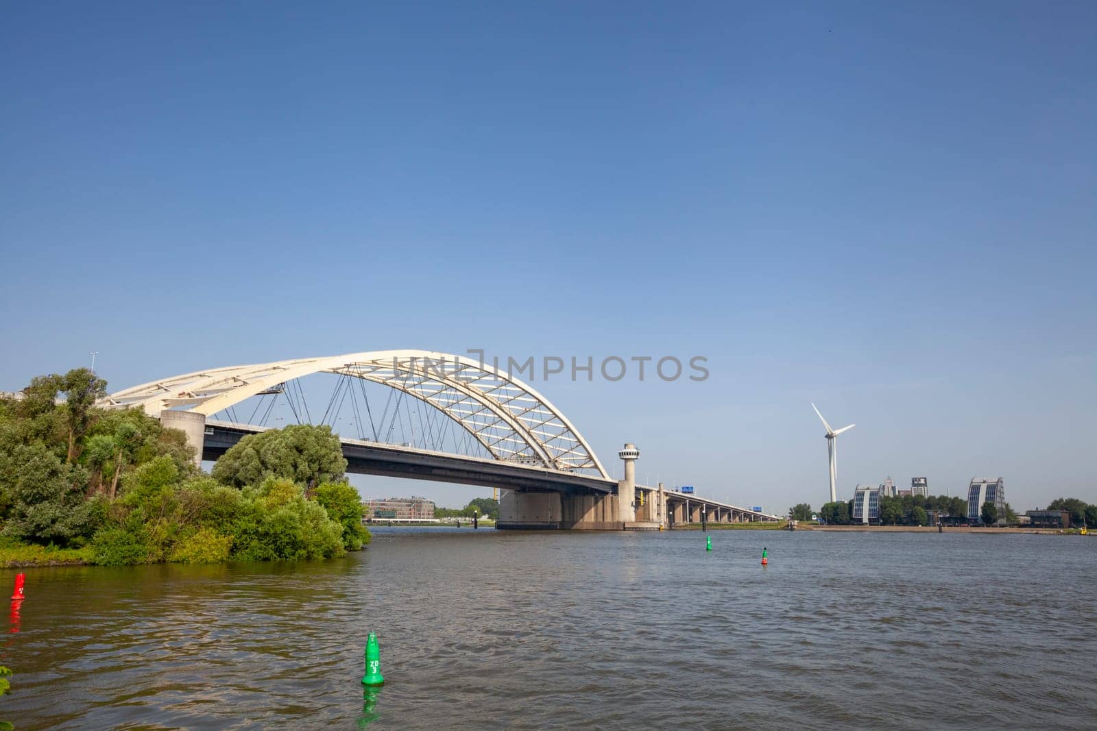 Van Brienenoord Bridge in Rotterdam over the river Nieuwe Maas seen from the north bank on the east side. The two arch bridges, part of the A16 motorway, were completed in 1965 and 1990 respectively.