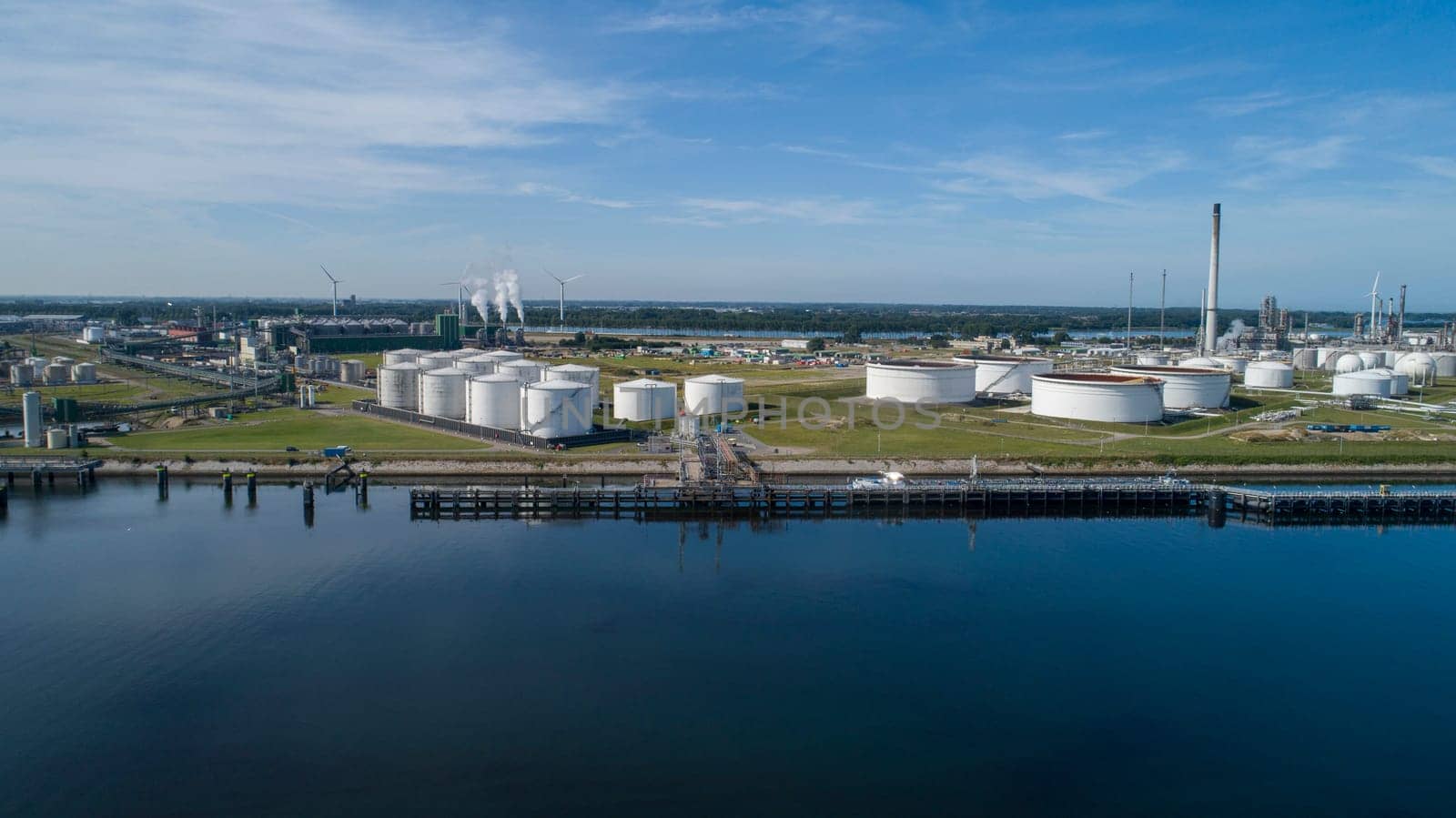 Oil refinery plant from industry zone, Aerial view oil and gas industrial, Refinery factory oil storage tank and pipeline steel