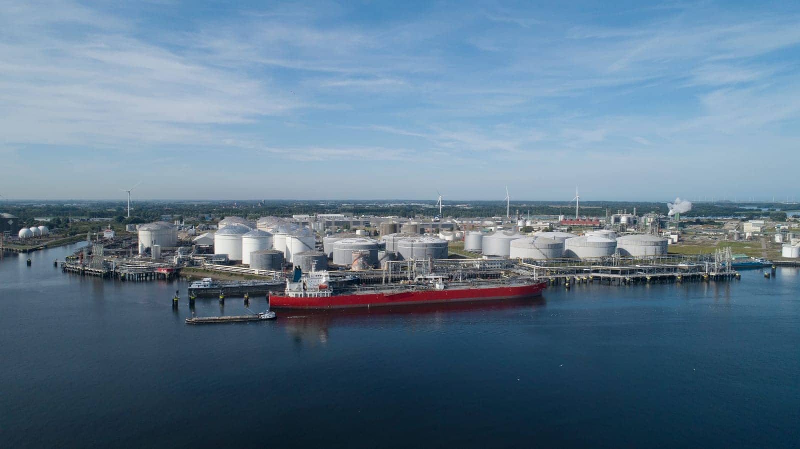 Port of Rotterdam. Botlek. Oil refinery plant from industry zone, Aerial view oil and gas industrial, Refinery factory oil storage tank and pipeline steel