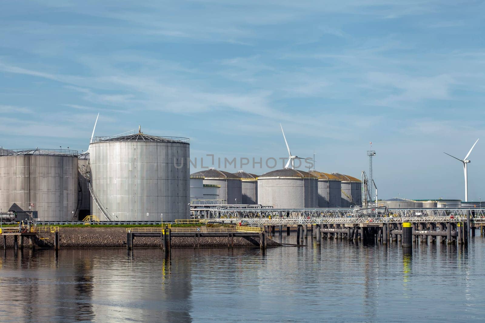 Port of Rotterdam. Botlek. Oil refinery plant from industry zone, Aerial view oil and gas industrial, Refinery factory oil storage tank and pipeline steel