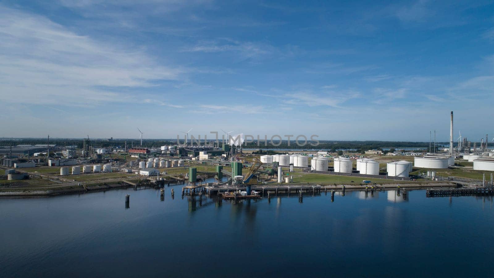Oil refinery plant from industry zone, Aerial view oil and gas industrial, Refinery factory oil storage tank and pipeline steel
