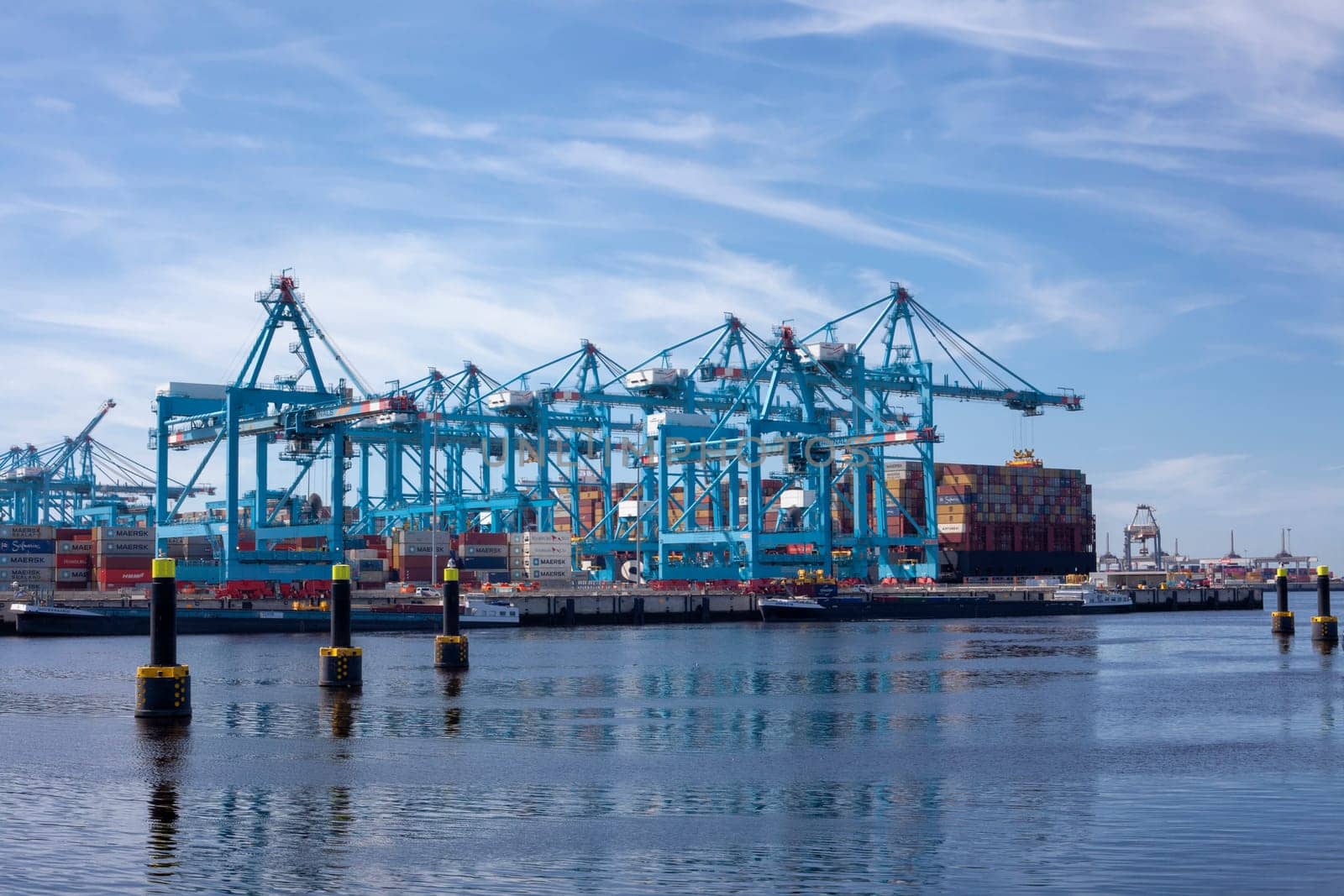 Rotterdam, Holland. Aerial view of container terminal in the harbor MAASVLAKTE, Netherlands. A large containership is unloading