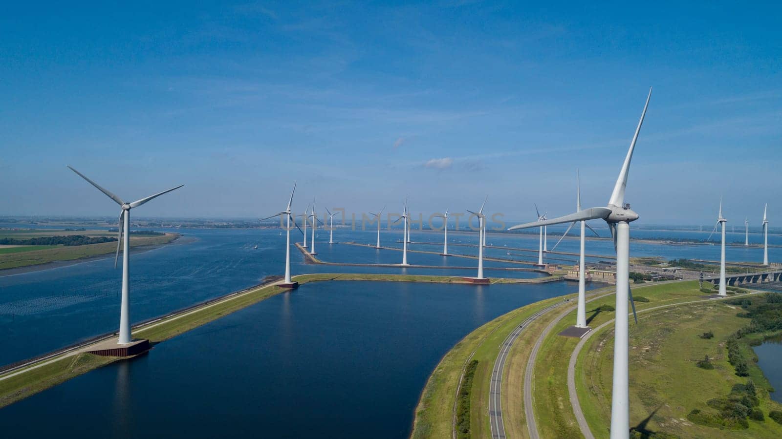 Wind turbine from aerial view, Drone view at windpark krammersluizen a windmill farm in the lake grevelingen in the Netherlands,Sustainable development, renewable energy