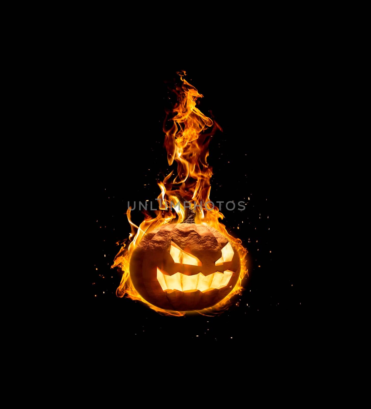 Halloween pumpkin, on fire on black background