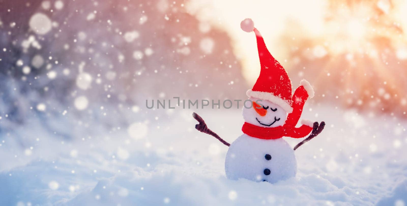 Little handmade snowman on the white snow on snowy background. Beautiful panoramic view.