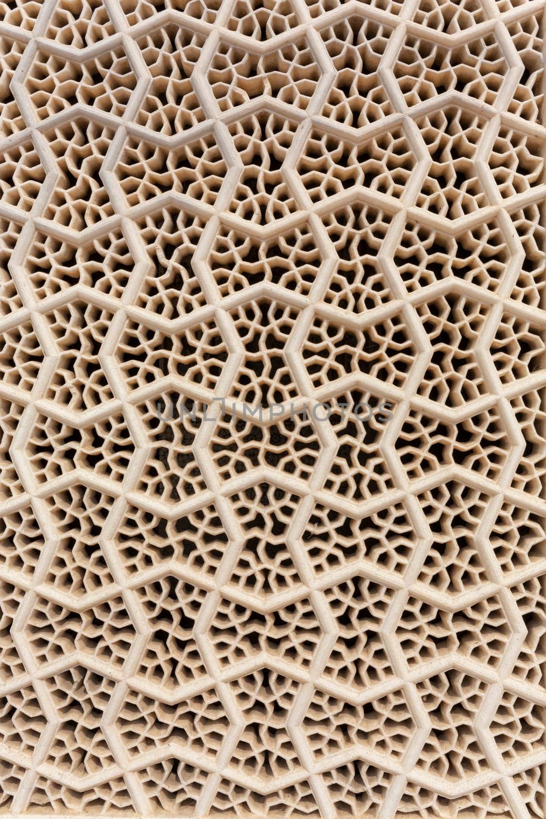 Perforated wall in the building of the palace in the Amber Fort, Jaipur, India
