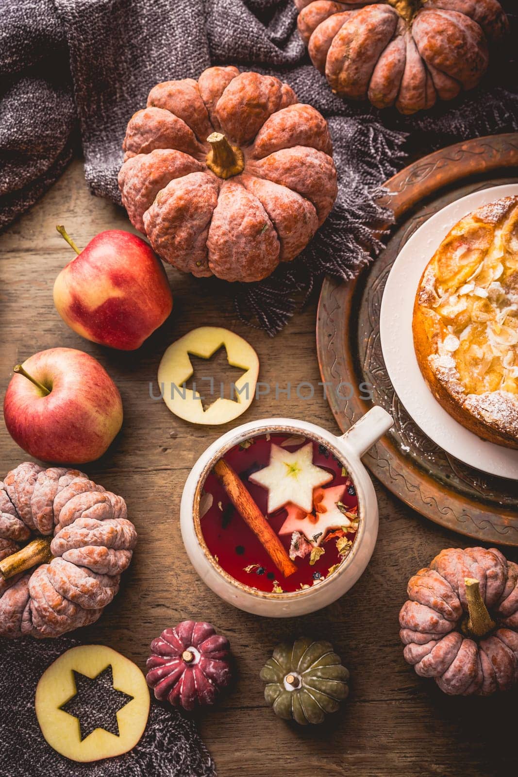 Herbal tea with fruits and cinnamon with apple pie for Thanksgiving.