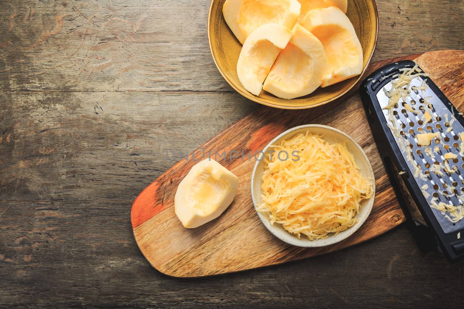 Peeled and  grated yellow zucchini or pumpkin, prepared for cooking